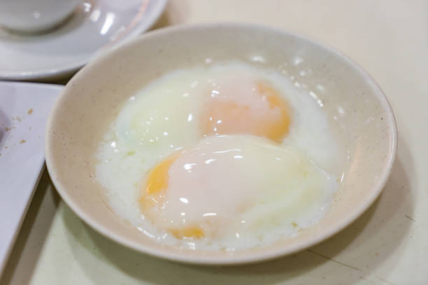 Singapore Breakfast Kaya Toast, Coffee bread and Half-boiled eggs Half boiled eggs, Traditional Singapore Breakfast called Kaya Toast, Original bread toast with kaya a local jam made from eggs, sugar and coconut milk kopitiam egg stock pictures, royalty-free photos & images
