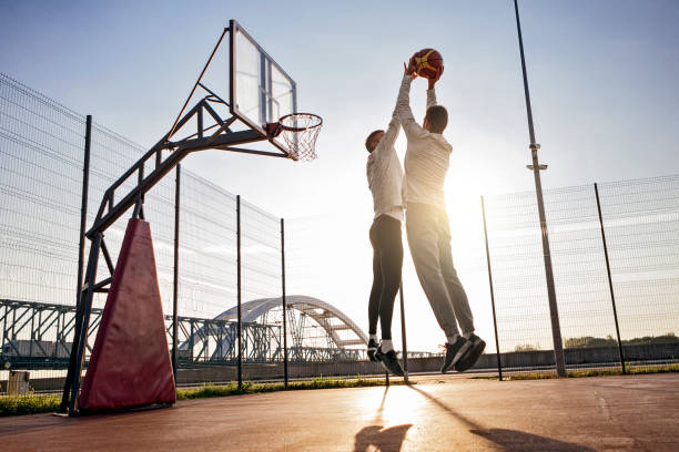 istock Basketball players playing with morning sun 856668520
