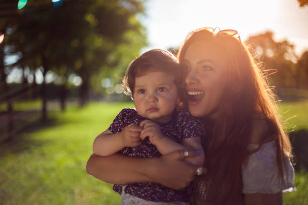 istock Young mother enjoying in nature with her daughter 856668724