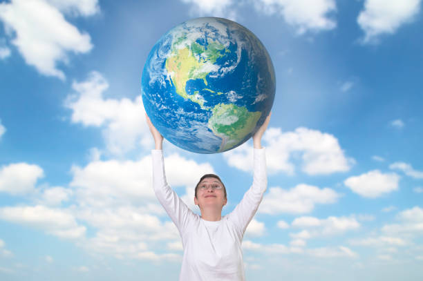 Smiling woman holding Earth planet. Image are furnished by NASA. stock photo