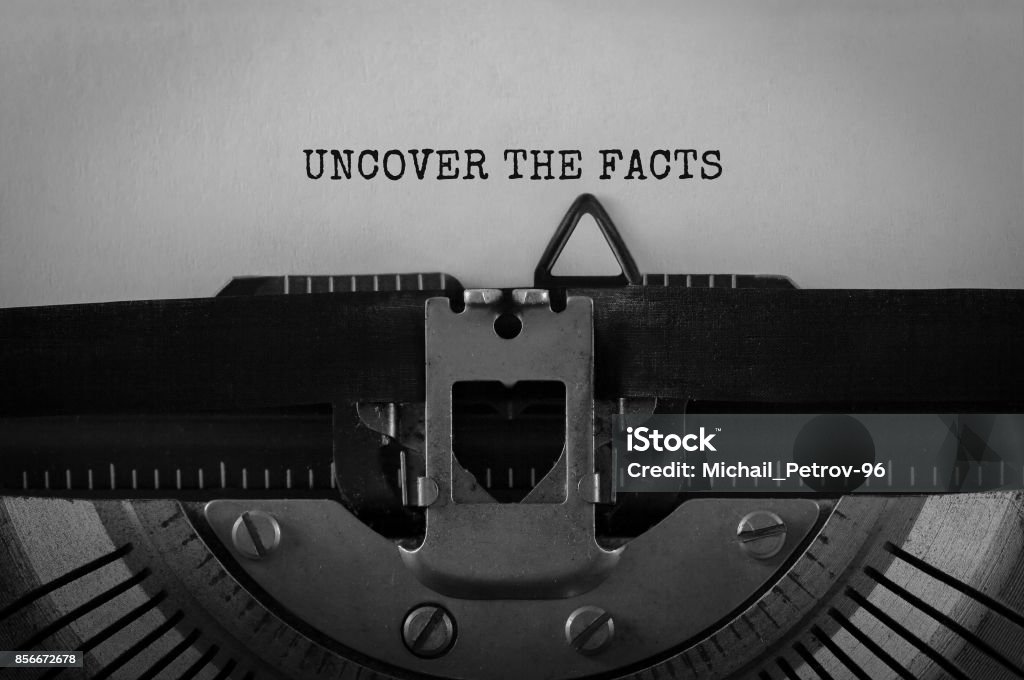 Text UNCOVER THE FACTS typed on retro typewriter Imagination Stock Photo