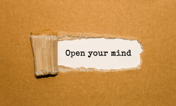 istock The text Open your mind appearing behind torn brown paper 856672702