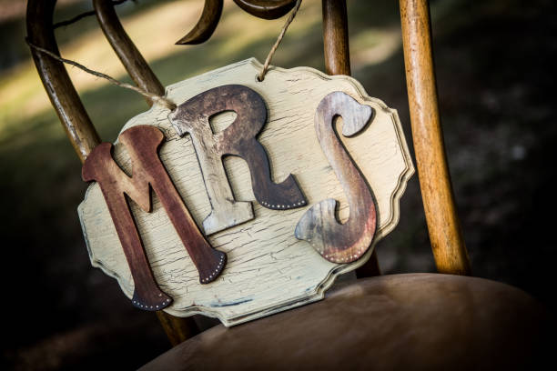 istock Rustic wedding sign sitting on a chair. 856675180