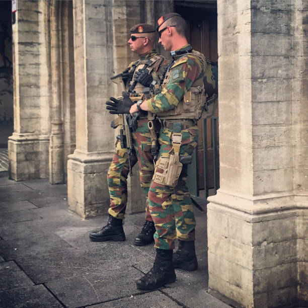 Armed forces patrolling Brussels city center, Belgium Brussels, Belgium - September 22, 2017: Armed forces patrolling Brussels city center. belgian culture photos stock pictures, royalty-free photos & images