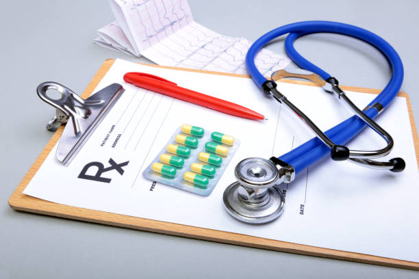 istock RX prescription, Red heart and a stethoscope isolated on white background 856686124