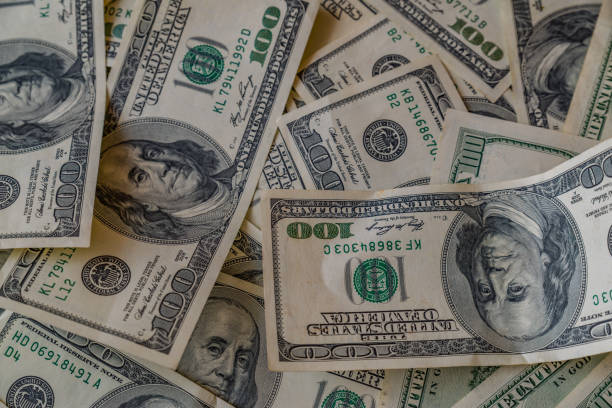istock Money on a wooden table 856686620