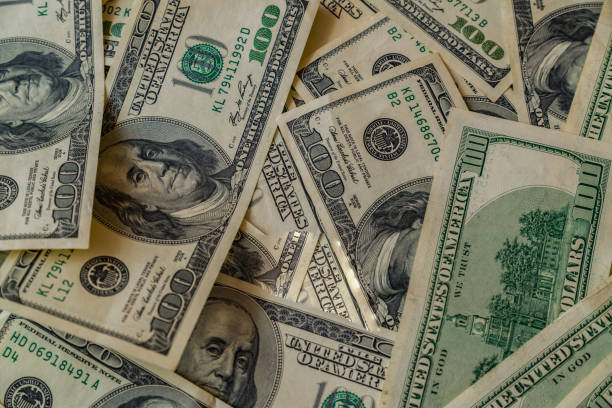 istock Money on a wooden table 856686720