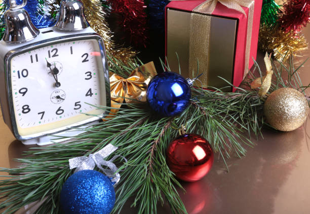 istock Colored balls , clock and gift boxes on christmas background. 856689752
