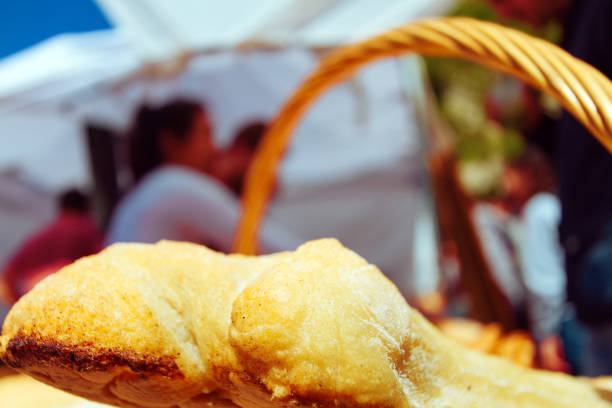 Close-up of various breads in a wicker basket on a street stall