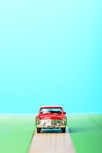 istock Red vintage car model on wooden boards 856696056