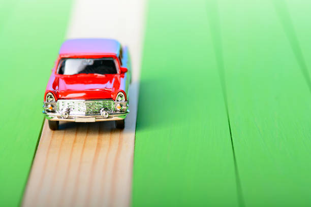 istock Red vintage car model on wooden boards 856696548