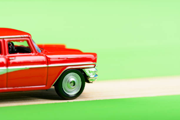 istock Red vintage car model on wooden boards 856697122