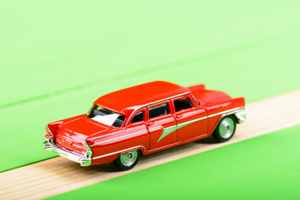istock Red vintage car model on wooden boards 856697190