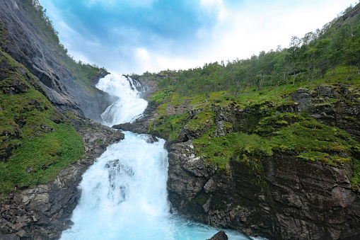 Kjosfossen waterfall near Myrdal in Norway is a popular stop of the famous Flam Railway (Flamsbana)