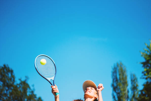 istock Female tennis player hitting the ball 856706180