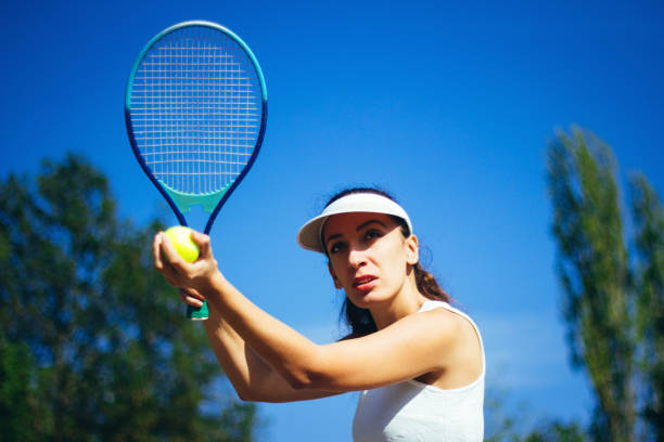 istock Female tennis player hitting the ball 856707126