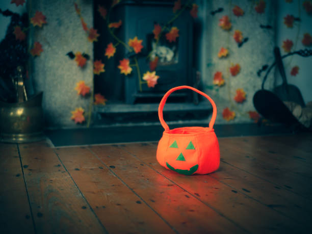 istock Pumpkin candy bags on wooden floor 856710586