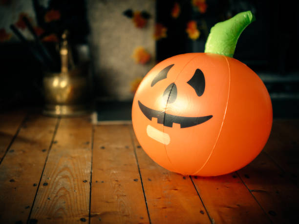 istock Halloween pumpkin balloon on wooden floor 856710664