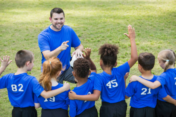 istock Children's soccer team talking with coach 856713456