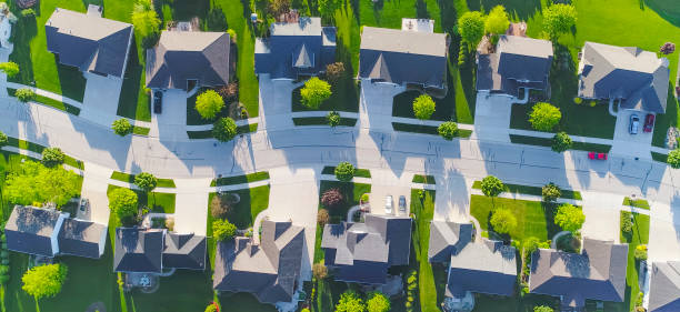 Idyllic neighborhood street, aerial view Idyllic neighborhood street, aerial view. aircraft point of view photos stock pictures, royalty-free photos & images