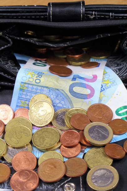 istock Coins and notes take out of a purse 856713630