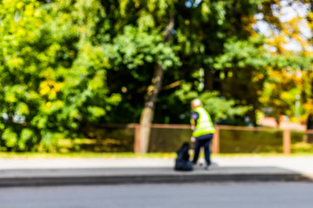 istock Abstract blurred background  - road sweeper worker cleaning city street with broom tool 856714240
