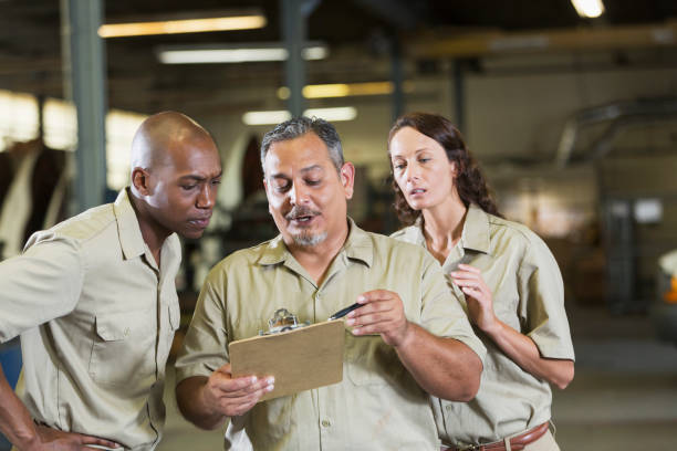 istock Workers in truck repair shop 856721712