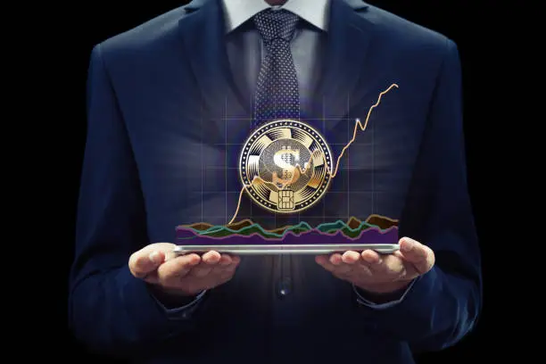 Cryptocurrency graph on virtual screen currency exchange. Business, Finance and technology concept. Bit coin, Ethereum block chain. Businessman with phone for on-line banking and e-commerce.