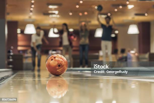 Friends Playing Bowling Stock Photo - Download Image Now - Activity, Adult, Arts Culture and Entertainment