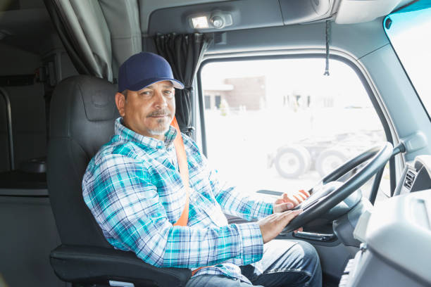 istock Hispanic man driving a semi-truck 856731450