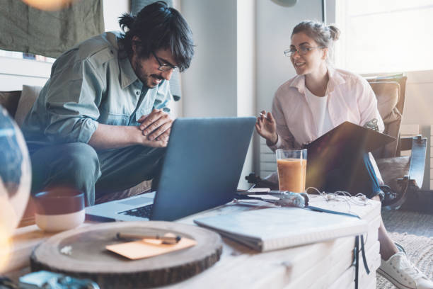 istock Man and woman working together in office 856736248