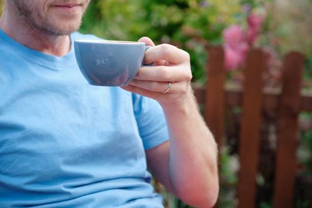 istock Man drinking coffee in the garden, England 856737430