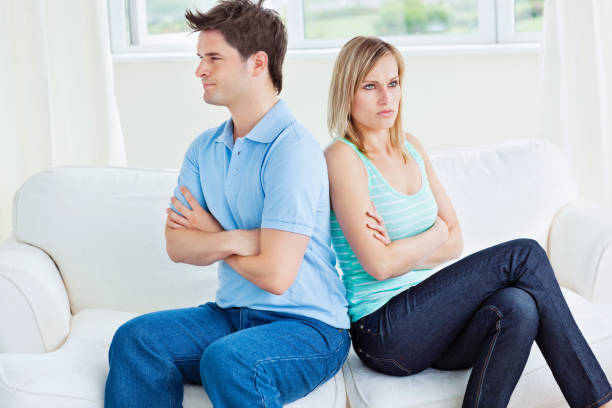 istock Young couple sulking after a conversation sitting back-to-back 856740528