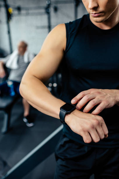 istock sportsman looking at smartwatch 856744268