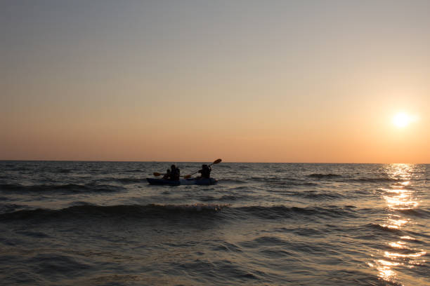 istock Canoe family activity during sun set 856746508