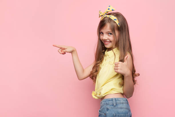 istock Stylish girl pointing away 856746704