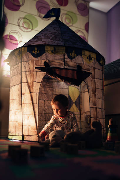 istock Little boy playing into castle toy at home. 856746798
