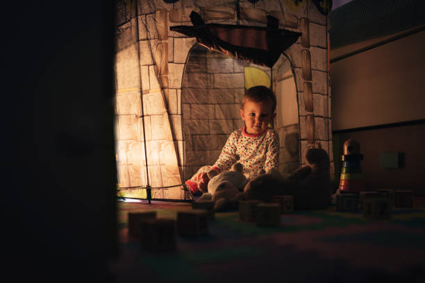 istock Little boy playing into castle toy at home. 856746814