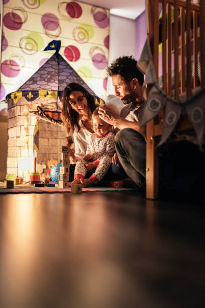 istock Parents enjoying playing with their son at home. 856747072
