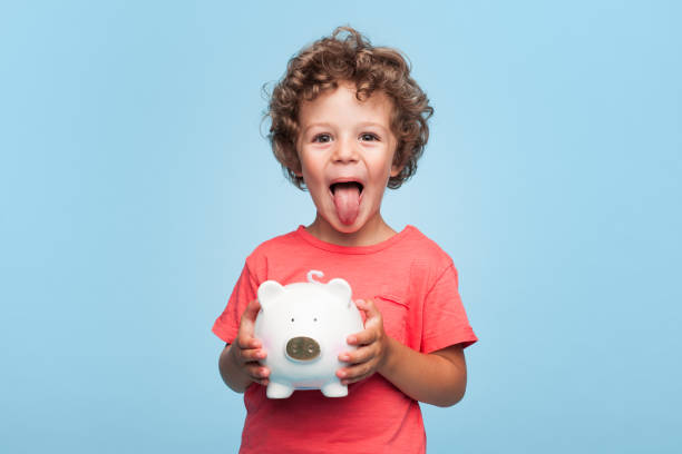 istock Happy kid with moneybox 856750504