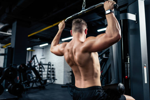 istock muscular sportsman lifting weights 856754206