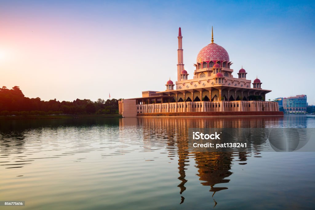 Putra mosque during sunrise Putra mosque during sunrise with reflection, Malaysia Kuala Lumpur Stock Photo