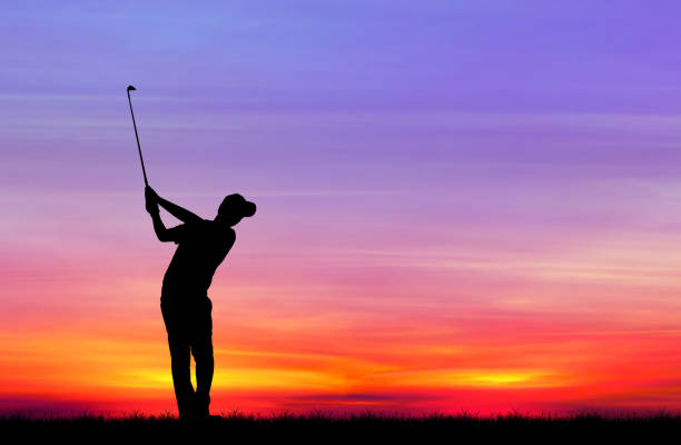 istock silhouette golfer playing golf during beautiful sunset 856783246