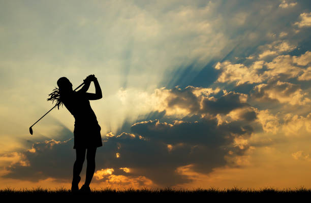 istock silhouette golfer playing golf during beautiful sunset 856783290