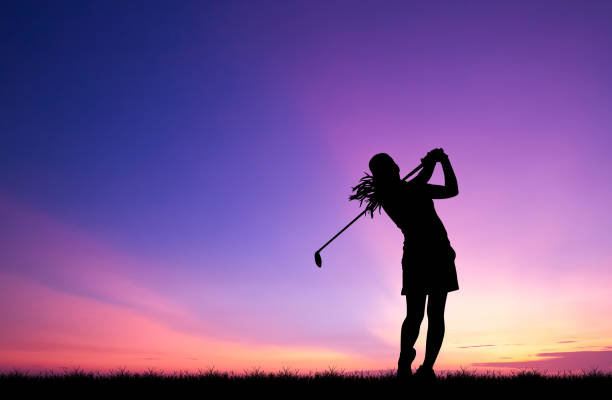 istock silhouette golfer playing golf during beautiful sunset 856783306
