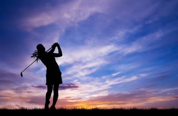 istock silhouette golfer playing golf during beautiful sunset 856783308