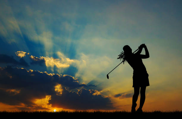 istock silhouette golfer playing golf during beautiful sunset 856783312