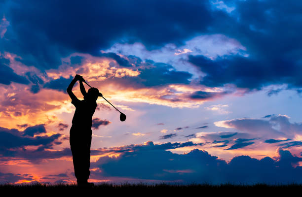 istock silhouette golfer playing golf during beautiful sunset 856783456