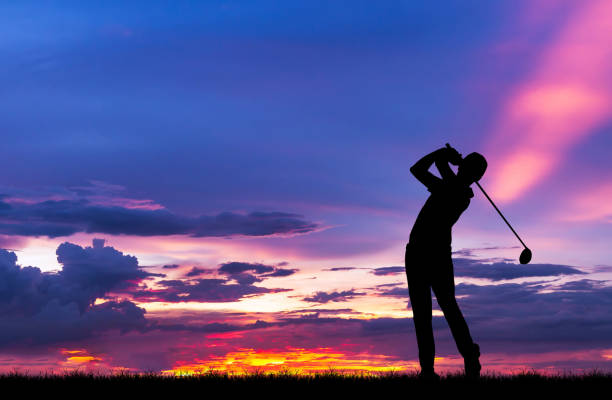 istock silhouette golfer playing golf during beautiful sunset 856783480
