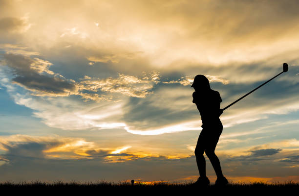 istock silhouette golfer playing golf during beautiful sunset 856783502